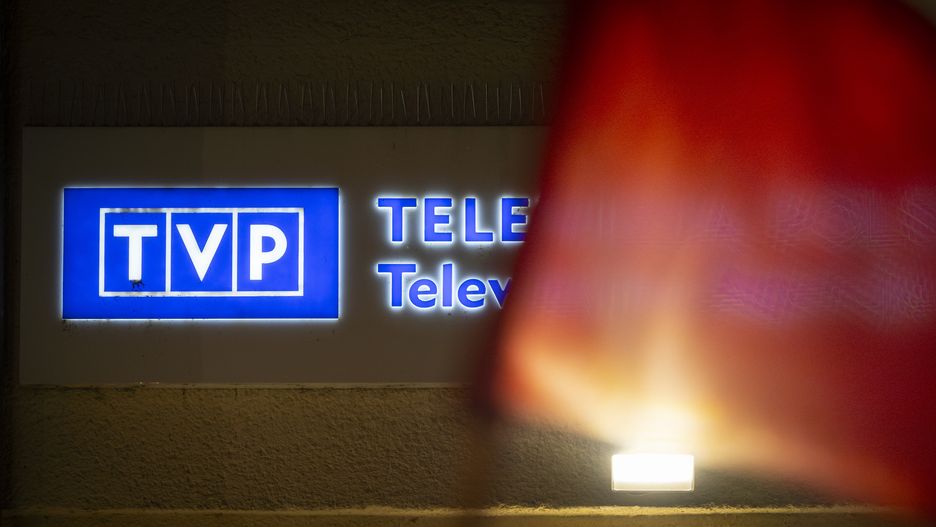 People are seen protesting against government media reforms in front of the public broadcaster TVP Info in Warsaw, Poland on 27 December, 2023. Management of public media institutions have been dismissed by the newly elected Donald Tusk led government on December 20th leading to protests as well as the occupying of media institutions by opposition MPs. Public media in the last eight years had been used as a government mouthpiece by the Eurosceptic Law and Justice party. (Photo by Jaap Arriens/NurPhoto via Getty Images)