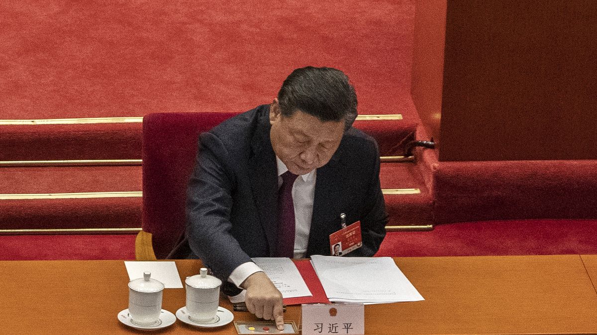 BEIJING, CHINA - MARCH 11: China's President Xi Jinping presses a button to vote in favour of a resolution to overhaul Hong Kong's electoral system, that was approved during the closing session of the National People's Congress at the Great Hall of the People on March 11, 2021 in Beijing, China. The annual political gatherings of the National Peoples Congress and the Chinese People's Political Consultative Conference, known as the Two Sessions, brings together China's leadership and lawmakers to set the blueprint for the coming year.  It is considered the most important event on the governments calendar and offers a rare glimpse at what President Xi Jinping and top officials see as priorities. With the pandemic largely under control in China, discussions this year are expected to signal Beijing's intentions around technology competition, control over Hong Kong, and strategic threats posed by Western countries including the United States. The political meetings, held at the Great Hall of the People at the edge of Tiananmen Square in central Beijing, can typically last for up to two weeks. (Photo by Kevin Frayer/Getty Images)
