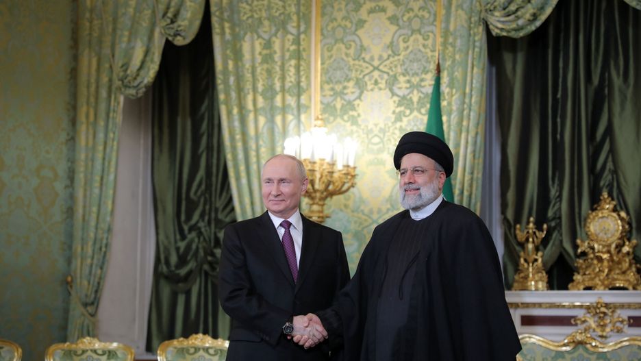 MOSCOW, RUSSIA - DECEMBER 07: (----EDITORIAL USE ONLY - MANDATORY CREDIT - 'IRANIAN PRESIDENCY / HANDOUT' - NO MARKETING NO ADVERTISING CAMPAIGNS) Russian President Vladimit Putin (L) meets with Iranian President Ebrahim Raisi (R) at Kremlin Palace in Moscow, Russia on December 07, 2023. (Photo by Iranian Presidency / Handout/Anadolu via Getty Images)