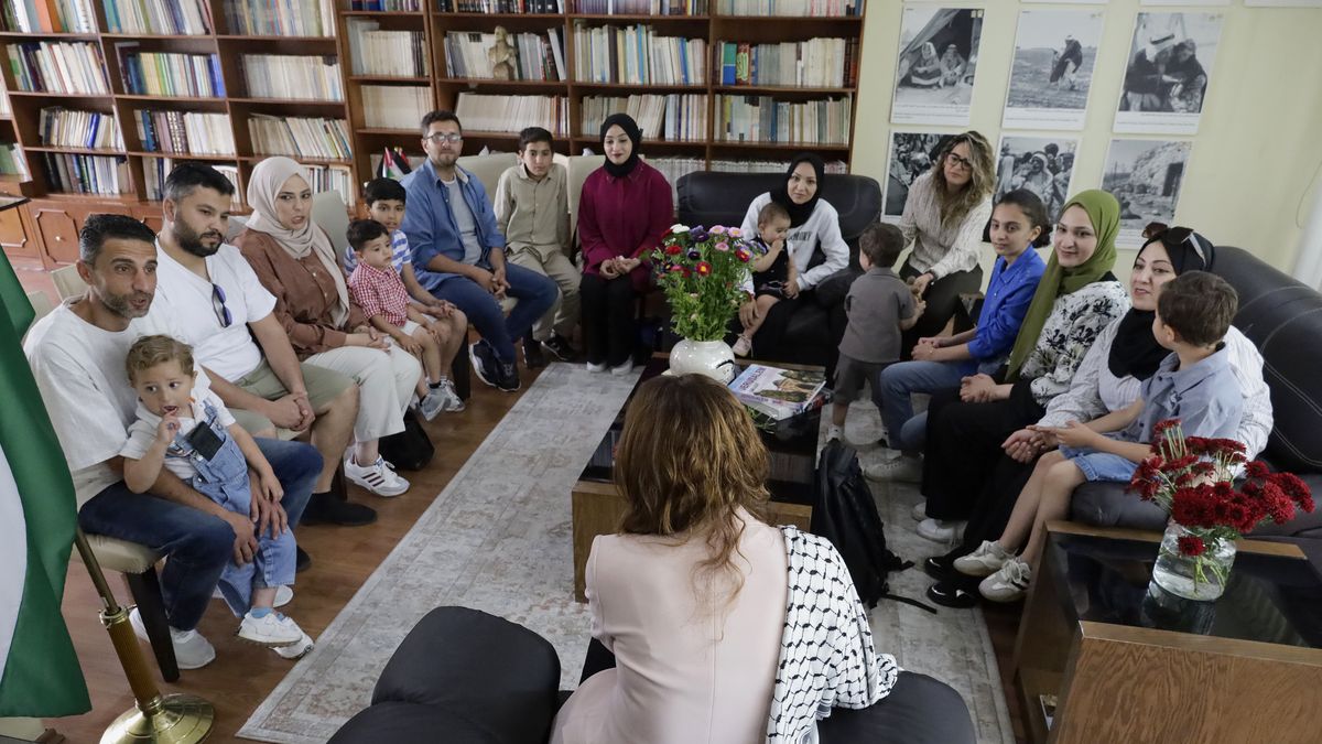 Nadya Rasheed (salmon-colored jacket), Palestinian ambassador to Mexico, stands with members of the Abed family, refugees in Mexico City, Mexico, on June 10, 2025, who a few days ago still live under attack by the Israeli army in the Gaza Strip. (Photo by Gerardo Vieyra/NurPhoto via Getty Images)