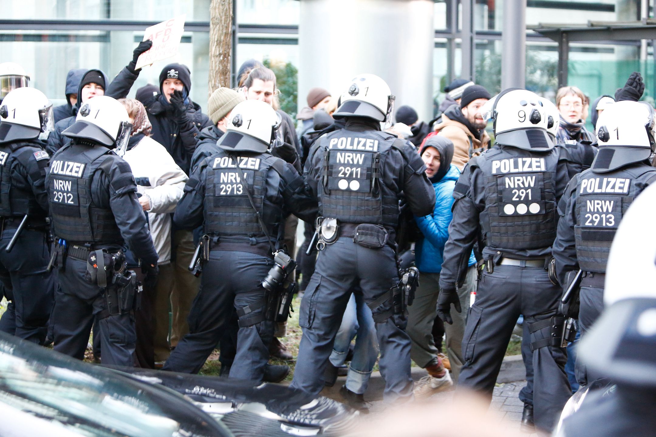 COLOGNE, GERMANY - FEBRUARY 04: German police clash with protesters as they protest against Friedrich Merz, the chancellor candidate of the Christian Union (CDU/CSU) parties, who came to Cologne for election activities before the early general elections to be held in Germany on February 23, in Cologne, Germany on February 04, 2025. (Photo by Kadir Ilboga/Anadolu via Getty Images)