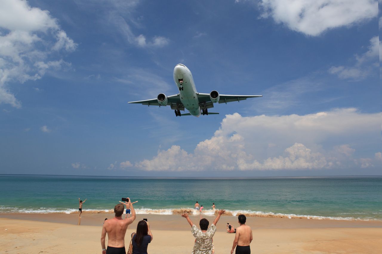 The Phuket airport is famous for being very close to the beach.