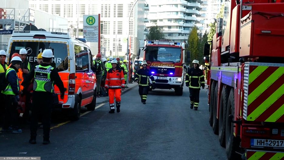 Temporary
Firemen and their engines are seen on October 30, 2023 close to a construction site in Hamburg, northern Germany, after a deadly accident. At least five workers were killed when a scaffolding collapsed at a building site, a fire brigade spokesman said. (Photo by STRINGER / NEWS5 / AFP)
STRINGER