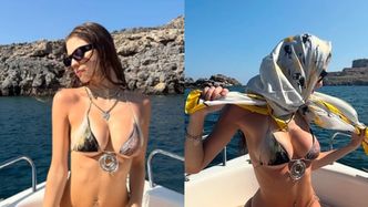 Bambi smaży się na łódce odziana w kuse bikini