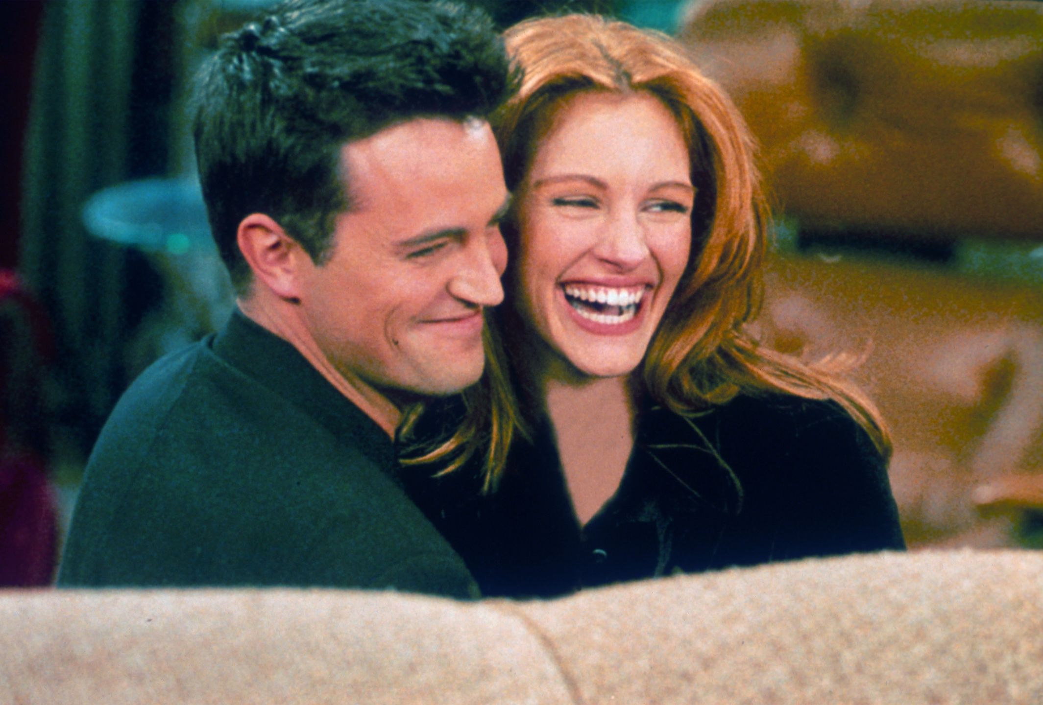 Actor Matthew Perry and actress Julia Roberts304422 21: Actor Matthew Perry and actress Julia Roberts hug each other on the set of "Friends." (Photo by Liaison)Getty Imagescelebrity, couple, guest, HALF LENGTH, LAUGHING, SET