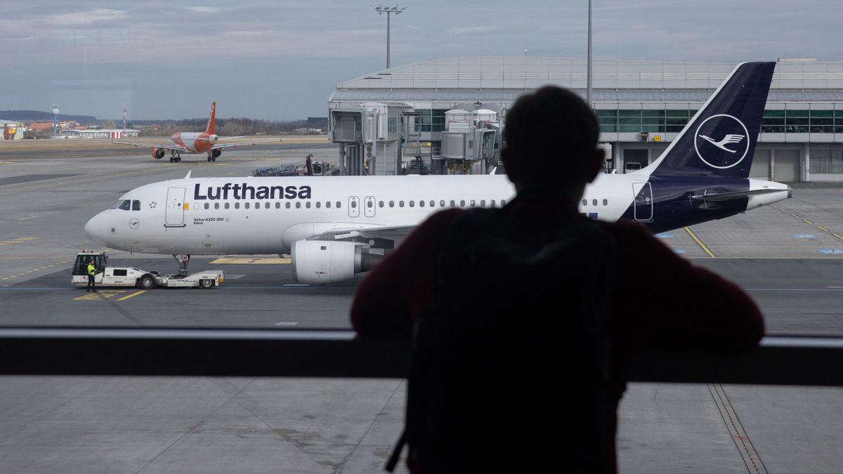 An Airbus SE A220-300 passenger jet, operated by Deutsche Lufthansa AG, at Vaclav Havel Airport in Prague, Czechia, on Wednesday, Feb. 14, 2024. With global air travel almost completely recovered from the pandemic, cutting emissions is once again the industry's No. 1 challenge. Photographer: Andrey Rudakov/Bloomberg via Getty Images