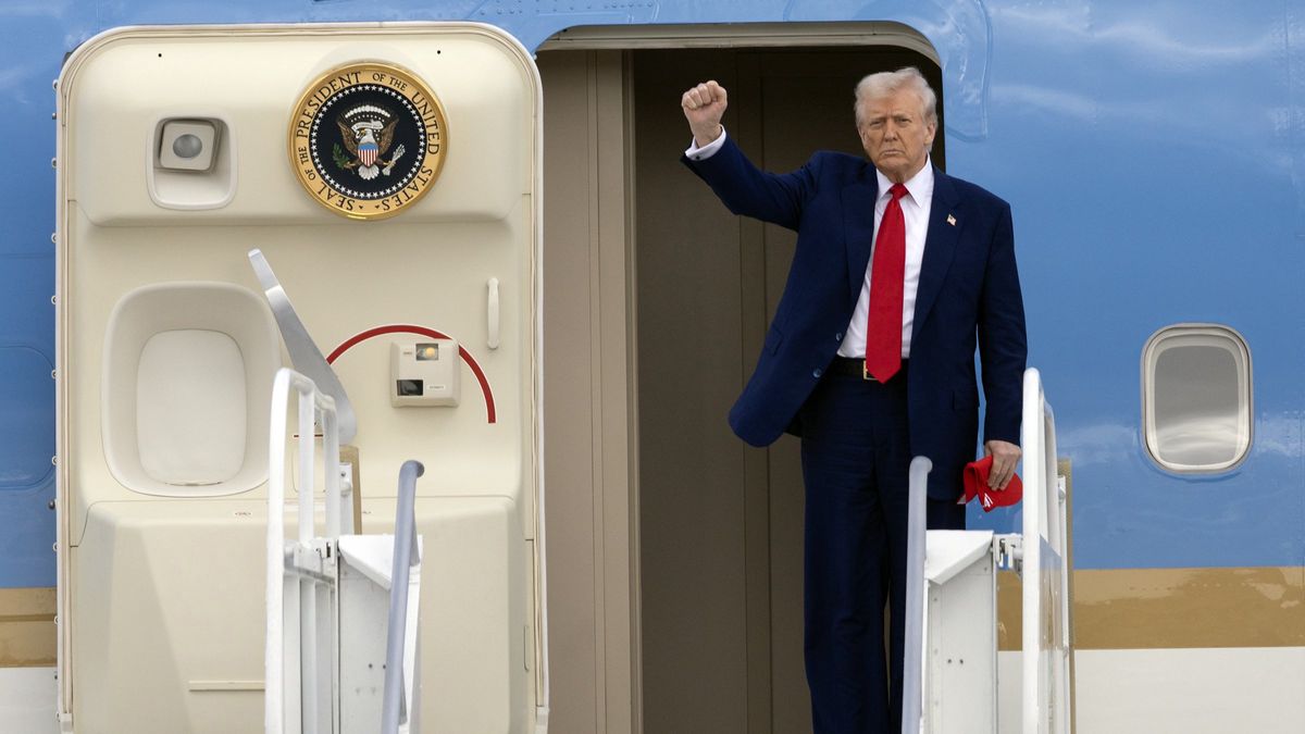 U.S. President Donald Trump pumps his fist upon arrival on Air Force One at Miami International Airport on Thursday, April 3, 2025. (Al Diaz/Miami Herald/Tribune News Service via Getty Images)