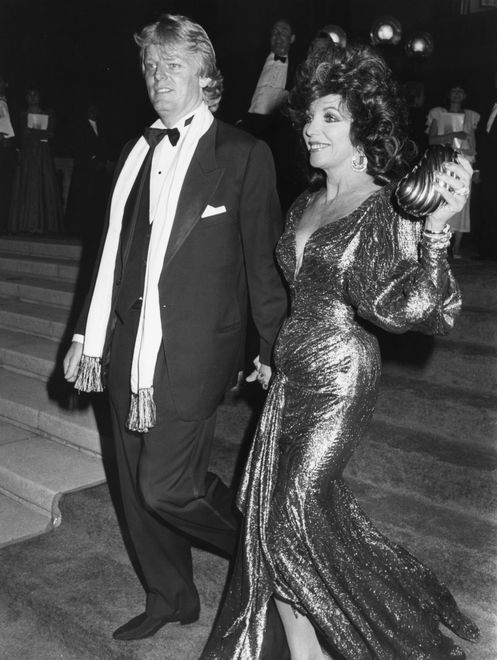 Peter Holm and Joan Collins during 38th Annual Primetime Emmy Awards at Pasadena Civic Auditorium in Pasadena, California, United States, 21st September 1986. (Photo by Vinnie Zuffante/Michael Ochs Archives/Getty Images)