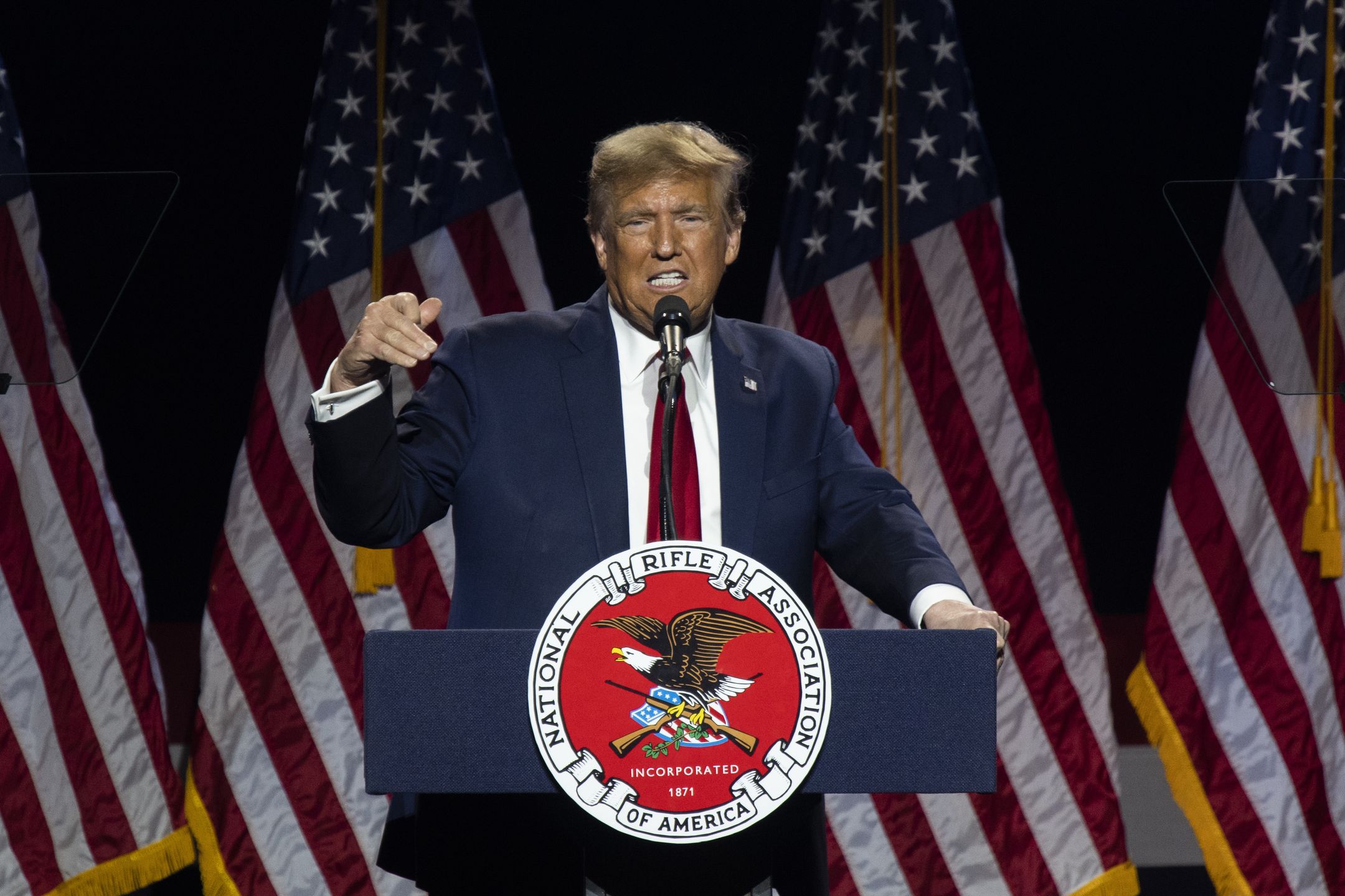 Former US President Donald Trump speaks during the National Rifle Association (NRA) Great American Outdoor Show Presidential Forum in Harrisburg, Pennsylvania, US, on Friday, Feb. 9, 2024. Trump is on the cusp of clinching the GOP nomination, a contest he has sought to wrap up quickly so that he can pivot to running against President Joe Biden, even as a series of court cases threaten to keep the former president from the trail. Photographer: Joe Lamberti/Bloomberg via Getty Images