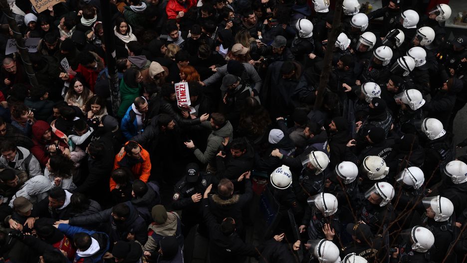 ISTANBUL, TURKEY - MARCH 20: University students clash with police during a protest march in support of arrested Istanbul Mayor Ekrem Imamoglu in Besiktas on March 20, 2025 in Besiktas, Istanbul, Turkey. On Wednesday, the Mayor of Istanbul Ekrem Imamoglu, who was due to be selected as a presidential candidate for the opposition Republican People's Party (CHP), was among 100 people arrested on an array of charges, from corruption to terrorism. Critics called the arrests politically motivated. (Photo by Burak Kara/Getty Images)