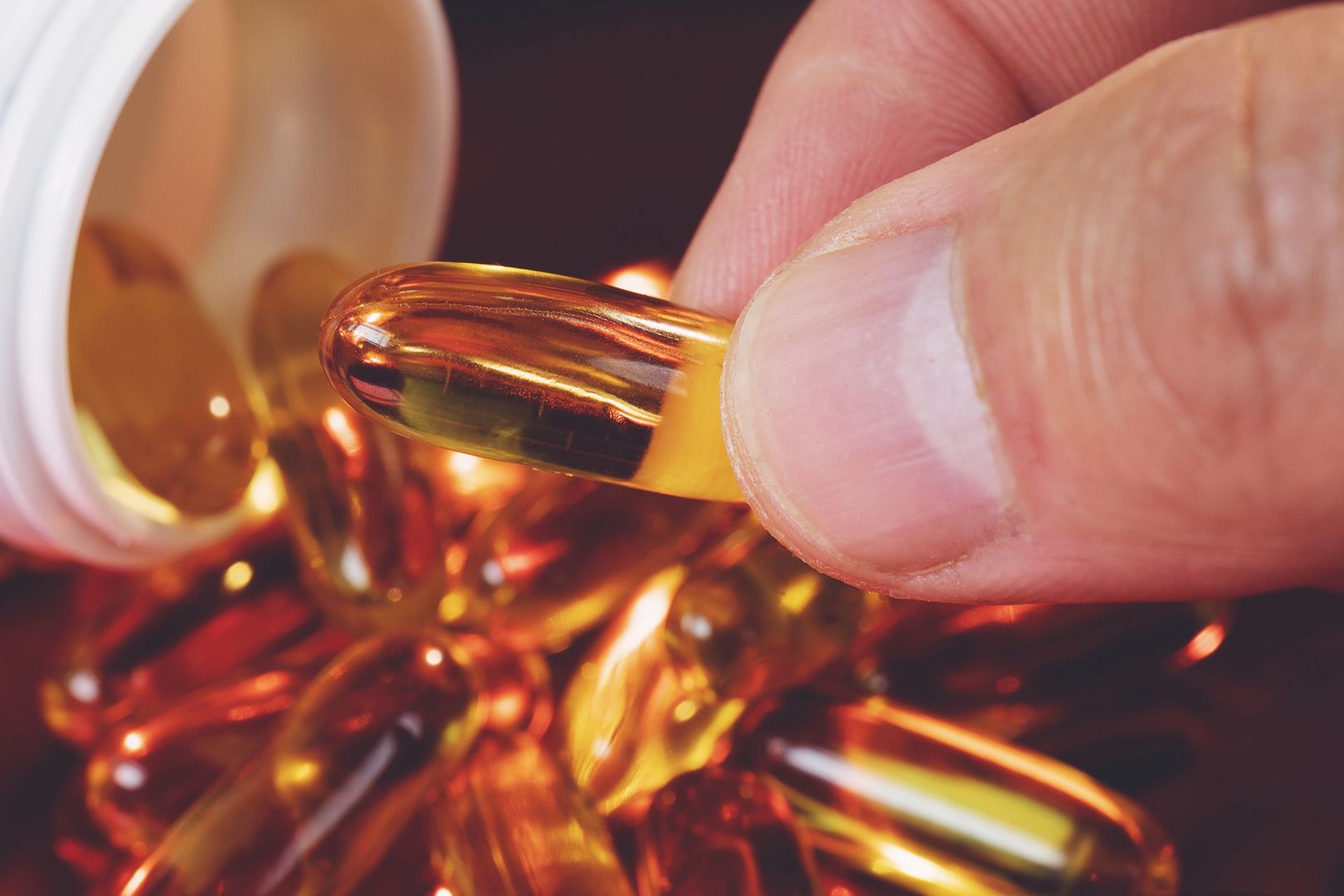 Hand holding a Fish oil capsule with blurred background
Pharmacy, Number 3, UK, Vitamin D, Fish Oil
batuhan toker