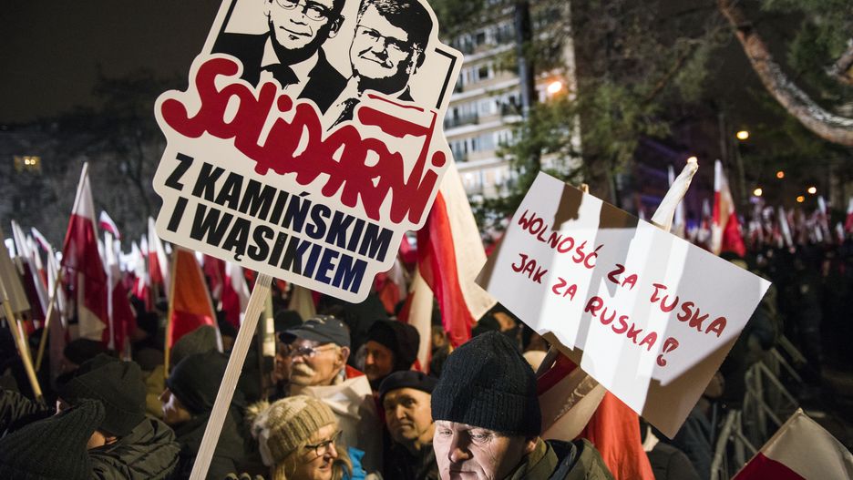 WARSAW, POLAND - 2024/01/11: A protester hold a placard that says Solidarity with Kaminski and Wasik during the demonstration. Poland's right-wing opposition, frustrated over its recent loss of power, urged its supporters to protest against moves by the new pro-European Union government to take control of state broadcasters and the state news agency. The Law and Justice party (PiS), which governed for eight years before losing October's parliamentary elections, called for a protest under the slogan "Protest of Free Poles" (Protest Wolnych Polakow) outside parliament. It portrayed the protest as a defense of democracy and free media, although during its time in power it was criticized for curbing media freedom. In one of its first steps, Tusk's government has moved to take control of the state television TVP, radio and news agency PAP, which Law and Justice turned into tools of aggressive propaganda against its critics and against Donald Tusk personally.
Law and Justice members, as well as their ally, President Andrzej Duda, are also protesting for Tuesday arrest of former Interior Minister Mariusz Kaminski and his former deputy Maciej Wasik ,two prominent figures in the former government who were convicted by a Warsaw court of abuse of power. Thousands of the right-wing supporters took part in the protest. (Photo by Attila Husejnow/SOPA Images/LightRocket via Getty Images)