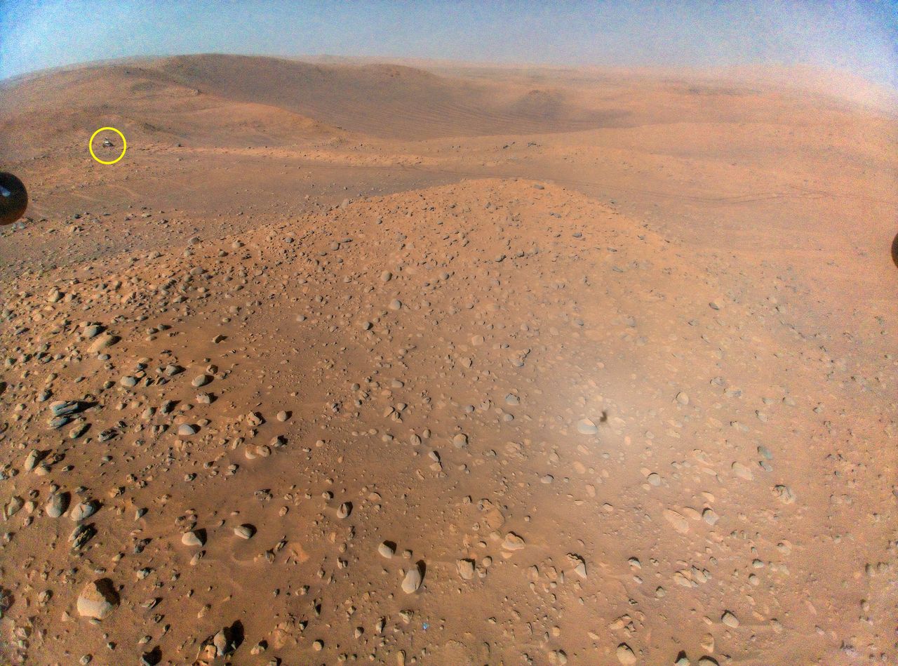 The blue sky over Mars and Perseverance seen from Ingenuity.