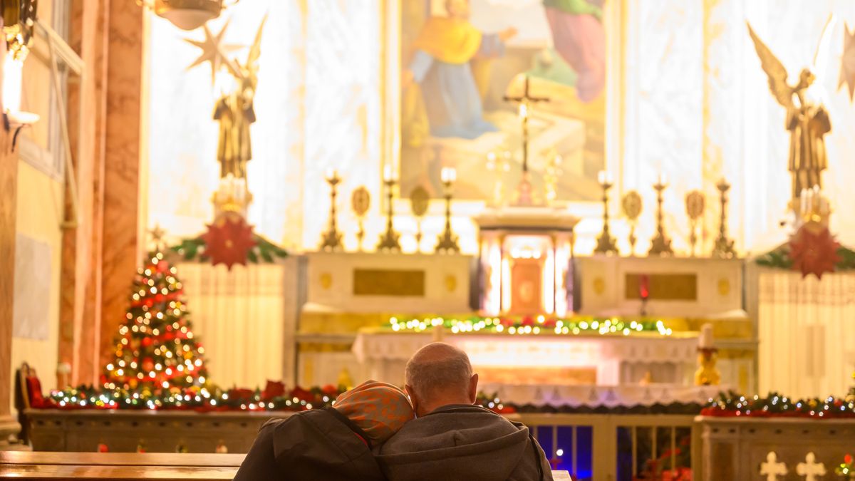 JAFFA, ISRAEL - DECEMBER 24: People pray ahead of mass at St. Peter's Church on Christmas Eve on December 24, 2023 in Jaffa, Israel. This year, due to the ongoing Israel-Hamas war Christmas celebrations were more subdued, including in Bethlehem, which sees thousands of tourists and visitors to the birthplace of Jesus Christ. It has been more than two months since the Oct. 7 attacks by Hamas that prompted Israel's retaliatory air and ground campaign in the Gaza Strip. (Photo by Alexi J. Rosenfeld/Getty Images)