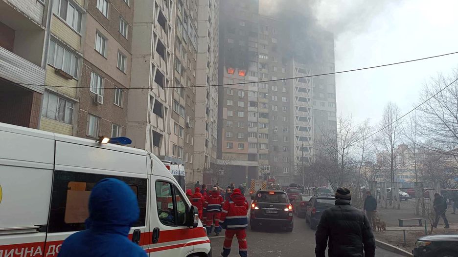 KYIV, UKRAINE - FEBRUARY 7, 2024 - Paramedics are seen at a block of flats in the Holosiivskyi district as a fire rages caused by the falling fragments of a Russian missile during the Russian missile attack on Wednesday morning, Kyiv. (Photo credit should read Serhii Loparev / Ukrinform/Future Publishing via Getty Images)