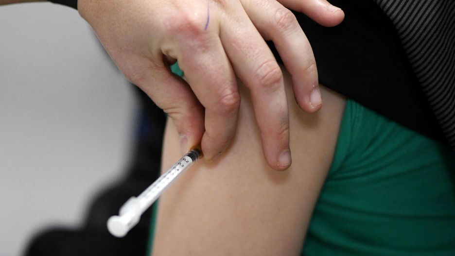 arch49A boy is inoculated with the Pfizer BioNTech vaccine for children at a vaccination centre set up at a car dealership in Iserlohn, western Germany, on January 5, 2022, amid the ongoing coronavirus (Covid-19) pandemic. - The owner of the car dealership, Arne Olsen, has temporarily set up a vaccination centre with a team of doctors and nurses at his dealership and has had several hundred people vaccinated since the start in December. As many people as possible are to be vaccinated by the second week of January. (Photo by Ina FASSBENDER / AFP)INA FASSBENDER