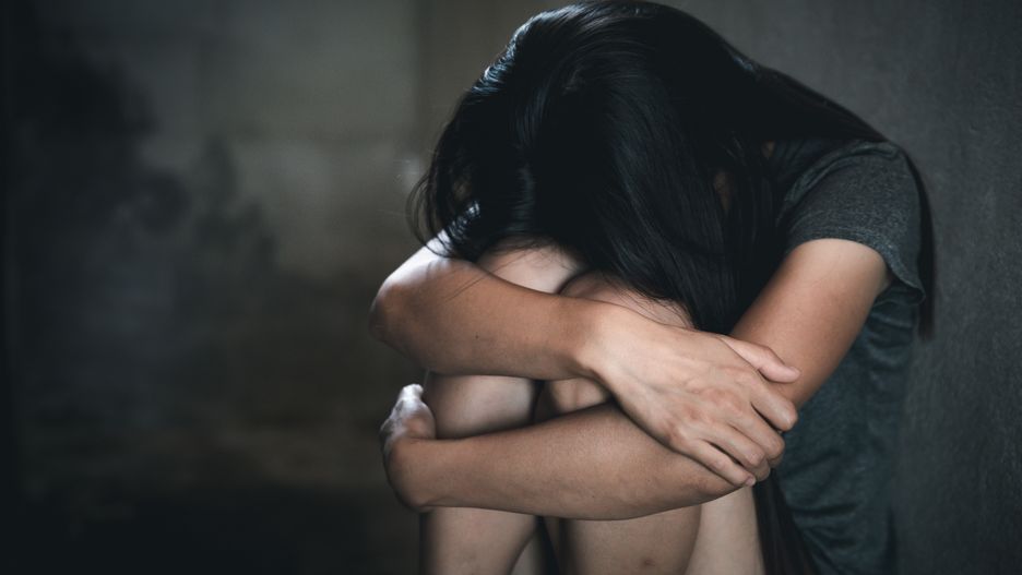 Young depressed woman, domestic and rape violence,beaten and raped sitting in the corner,  Copy space.  International Women's Daythriller, horror, girlfriend, sex, room, molest, concept, trafficking, fight, relationship, hand, criminal, bad, violent, feelings, abused, assault, emotional, stop, woman, afraid, raped, aggression, pain, stress, violence, victim, crime, sad, crying, rape, rope, prisoner, young, abuse, sexual, scared, hurt, harassment, girl, fear, female, domestic, women, despair, threat, depression, help, people, cruel