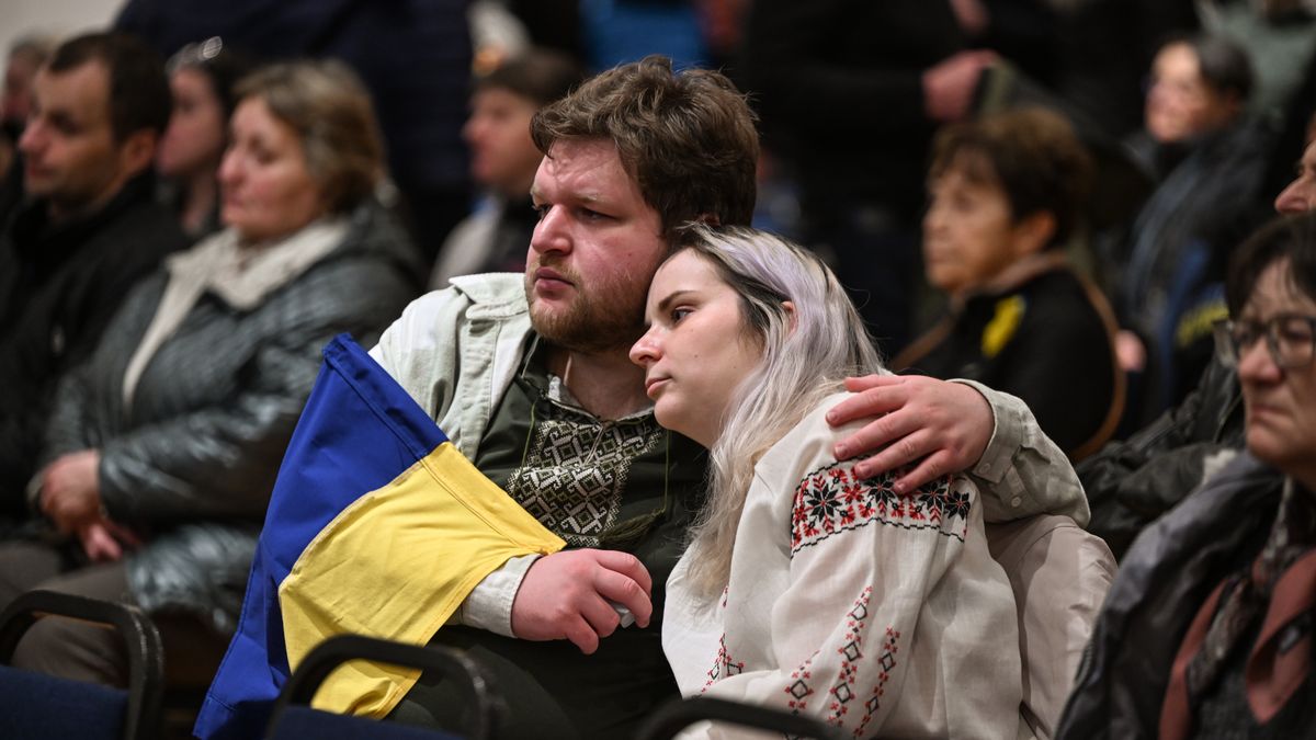 EDMONTON, CANADA  FEBRUARY 24: Members of the Ukrainian diaspora react with emotion while watching a video on the Russia's special military operation at St. Basil Ukrainian Cultural Center, marking the third anniversary of Russia-Ukraine war, in Edmonton, Alberta, Canada on February 24, 2025. Since the war, an estimated 300,000 Ukrainians have fled to Canada as refugees, with approximately 65,000 settling in Alberta. (Photo by Artur Widak/Anadolu via Getty Images)