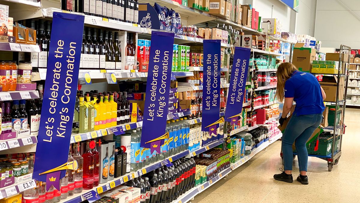 PORTLAND, ENGLAND - APRIL 24: Signs reading, 'Let's celebrate the King's Coronation' are seen in a Tesco store, on April 24, 2023 in Portland, England. The Coronation of King Charles III and The Queen Consort will take place on May 6, part of a three-day celebration. (Photo by Finnbarr Webster/Getty Images)