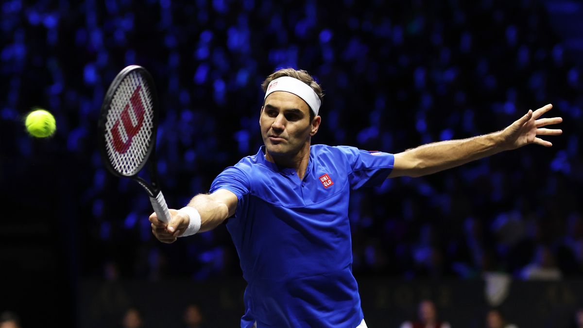 LONDON, ENGLAND - SEPTEMBER 23: Roger Federer of Team Europe plays a backhand during the doubles match between Jack Sock and Frances Tiafoe of Team World and Roger Federer and Rafael Nadal of Team Europe during Day One of the Laver Cup at The O2 Arena on September 23, 2022 in London, England. (Photo by Clive Brunskill/Getty Images for Laver Cup)