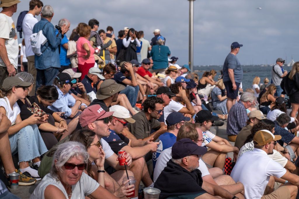 A large group of people follow the sailing races from the
BARCELONA, CATALONIA, SPAIN - 2024/10/13: A large group of people follow the sailing races from the beach. The second day of the America's Cup final took place in Barcelona today. Fans of the two teams that made it to the final, Emirates and Ineos, were able to follow the race from the beaches and bars of Barceloneta. (Photo by Paco Freire/SOPA Images/LightRocket via Getty Images)
SOPA Images
sailing race, crowd, ineos, supporters, louis vuitton, fans, emirates