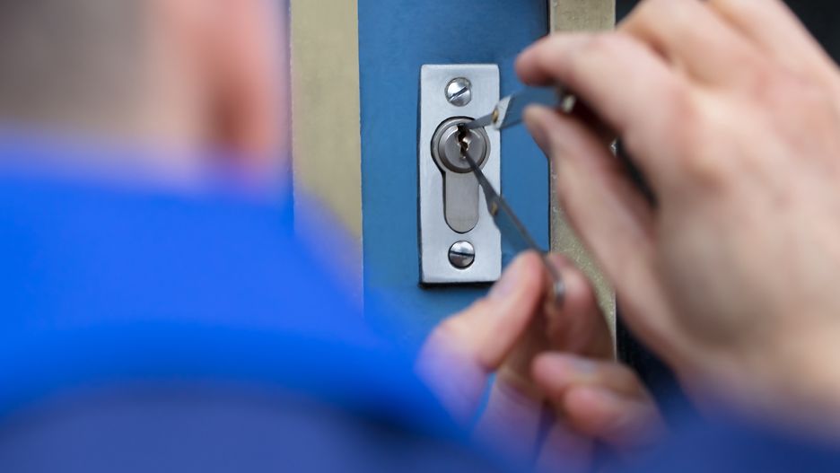 Close-up Of A Young Man Opening Door With LockpickerAndrey Popovlocksmith, door, man, security, service, thief, safe, burglar, opening, break, open, burglary, young, headshot, robbery, theft, home, steal, lock, damage