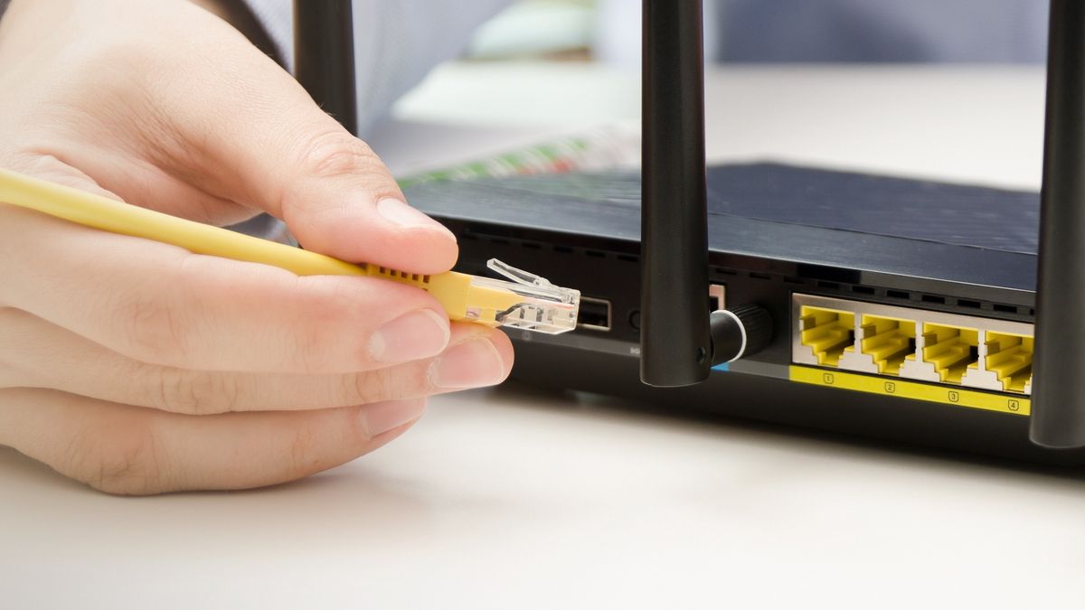 Man plugs Ethernet cable into routerMan plugs Ethernet cable into router. router wireless wire broadband home office cable plug conceptrouter, wireless, wire, broadband, home, office, cable, plug, switch, laptop, computer, wifi, technology, secure, ethernet, support, wan, network, plug-in, modern, telecommunication, internet, wi-fi, gateway, work, wlan, access, antenna, black, business, communication, connect, connection, data, digital, electronic, equipment, firewall, hardware, lan, mobile, speed, device, horizontal, male, man, on-line, person, router, wireless, wire, broadband, home, office, cable, plug, switch, laptop, computer, wifi, technology, secure, ethernet, support, wan, network, plug-in, modern, telecommunication, internet, wi-fi, gateway, work, wlan, access, antenna, black, business, communication, connect, connection, data, digital, electronic, equipment, firewall, hardware, lan, mobile, speed, device, horizontal, male, man, on-line, person