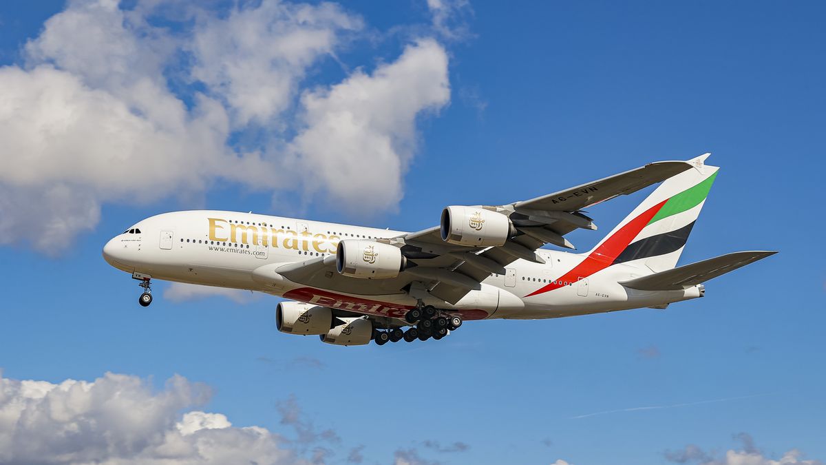 Emirates Airbus A380 aircraft as seen flying on final approach during a blue sky summer sunny day with some clouds, arriving from Dubai DXB UAE, flying over the houses of Myrtle avenue in London, a famous location for planespotting, for landing at the capital of England, London Heathrow Airport LHR airport in the UK. The wide body double decker airplane has the registration A6-EVN and is powered by 4x RR Rolls Royce jet engines. Emirates is one of the two flag carrier airline of the United Arab Emirates owned by the government of Dubai. It is the fourth largest airline in the world with a fleet of 262 planes and the largest A380 and Boeing 777 operator. As of summer 2022 many airlines returned their quad engine super jumbo long haul planes as the passenger traffic increased with high demand, a period after the Covid-19 Coronavirus pandemic with lockdown, travel restrictions and safety measures. London, United Kingdom on August 2022  (Photo by Nicolas Economou/NurPhoto via Getty Images)