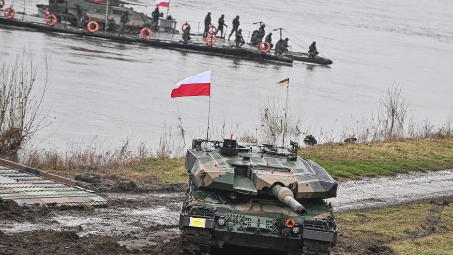 KORZENIEWO, POLAND - MARCH 05 : Polish Soldiers drive a Leopard 2PL tank after crossing the Vistula River during the DRAGON-24 NATO  military defense drills  on March 05, 2024 in Korzeniewo, Poland. In the first half of 2024, NATO is conducting a series of exercises under the overarching umbrella of STEADFAST DEFENDER-24 (STDE-24) exercise. The exercises, which will take place mainly in Central Europe, will involve some 90,000 troops from all NATO countries as well as Sweden. (Photo by Omar Marques/Anadolu via Getty Images)