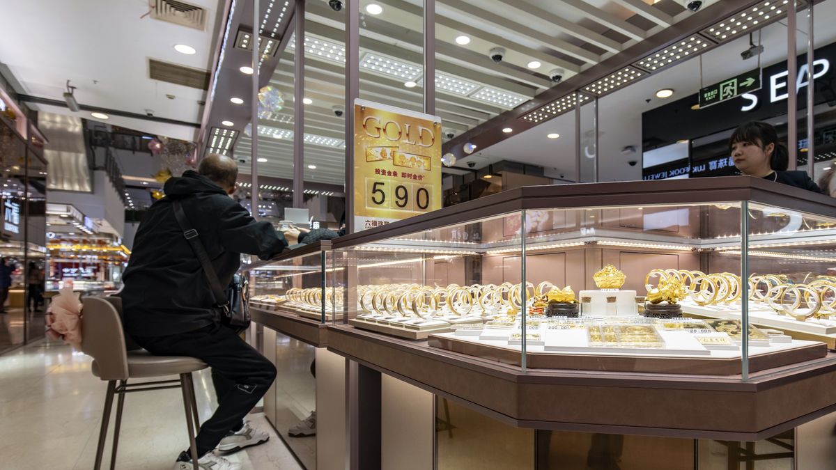 A customer inside a Luk Fook Holdings International Ltd. jewelry store in Shanghai, China, on Wednesday, March 13, 2024. Weighing as little as one gram, the beans  and other forms of gold jewelry  are increasingly viewed as the safest investment bet for young Chinese in an era of economic uncertainty. Photographer: Qilai Shen/Bloomberg via Getty Images