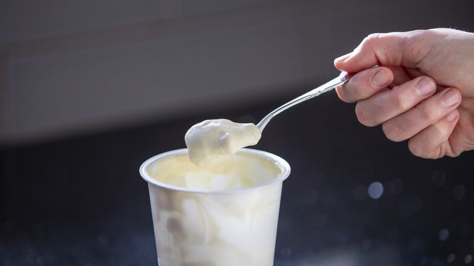 Eating Yoghurt out of a plastic yoghurt pot