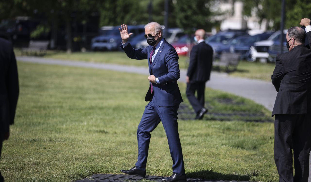 U.S. President Joe Biden waves before boarding Marine One on the Ellipse near the White House in Washington, D.C., U.S., on Tuesday, May 18, 2021. Biden's infrastructure proposal includes billions of dollars tied to improving cybersecurity, an area of intensified interest after the ransomware attack on the Colonial Pipeline Co. sent U.S. gasoline prices soaring last week. Photographer: Oliver Contreras/Sipa/Bloomberg via Getty Images