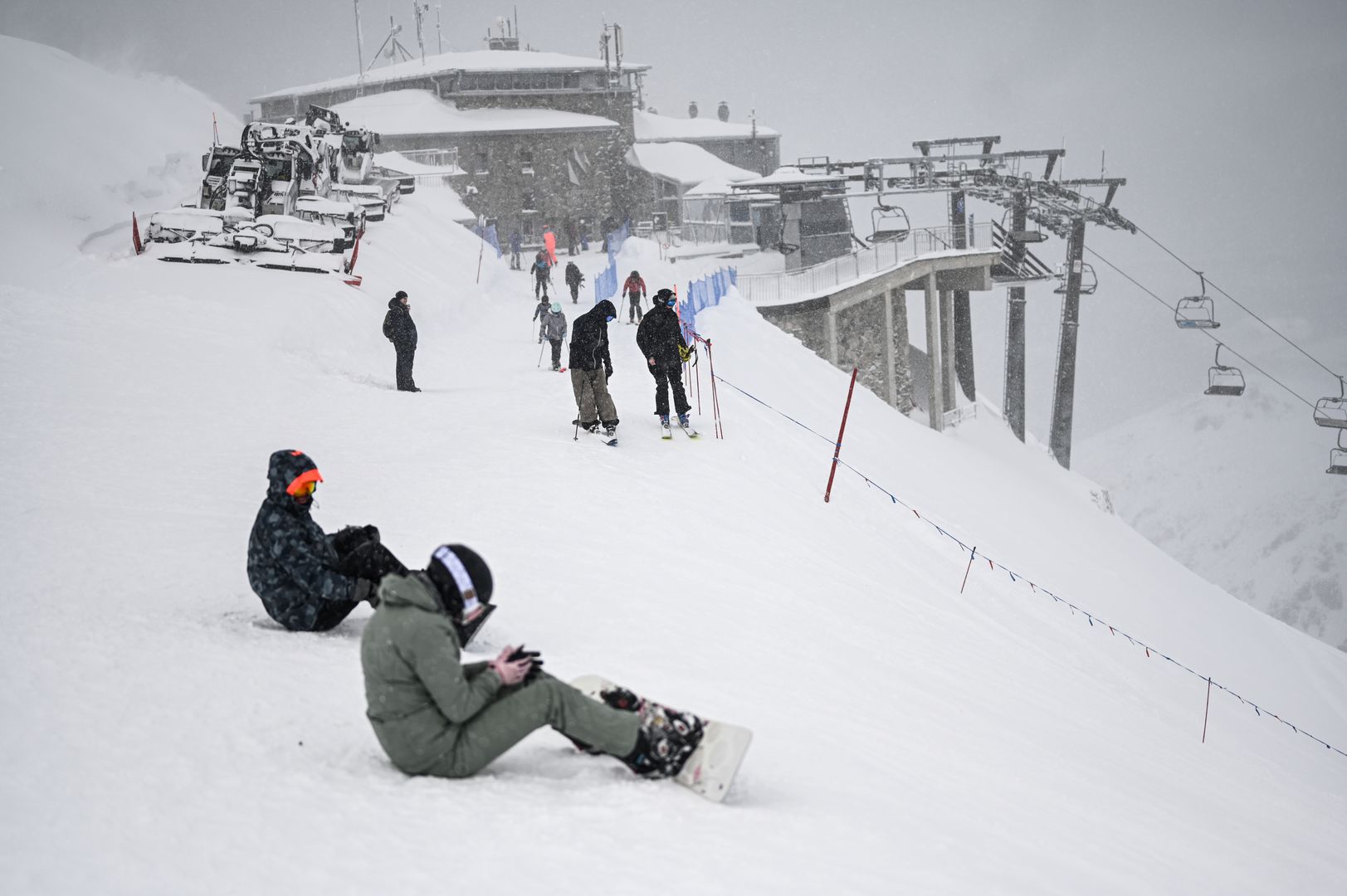 ZAKOPANE, POLAND - JANUARY 16: People and skiers are seen at the Kasprowy Wierch peak during a snowstorm in Zakopane, Poland on January 16, 2024. Kasprowy Wierch is one of the most famous peaks of the Tatra mountains in Southern Poland, which is also a winter attraction as ski lifts and trails are available for visitors. More than 90 cm of snow has fallen in Tatras and more snowfall is predicted during the upcoming weeks. (Photo by Omar Marques/Anadolu via Getty Images)