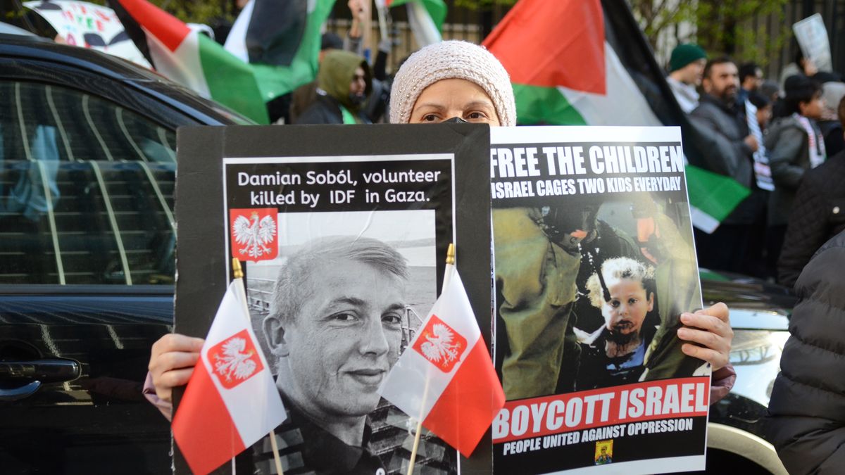 CHICAGO, ILLINOIS - APRIL 5: A protester holds a photo of Damian Sobol from World Central Kitchen during a pro-Palestinian protest outside the Israeli consulate in Chicago, Illinois, United States on April 5, 2024. Damian Sobol was a Polish volunteer who was killed during a humanitarian mission in Gaza on April 1, 2024. (Photo by Jacek Boczarski/Anadolu via Getty Images)