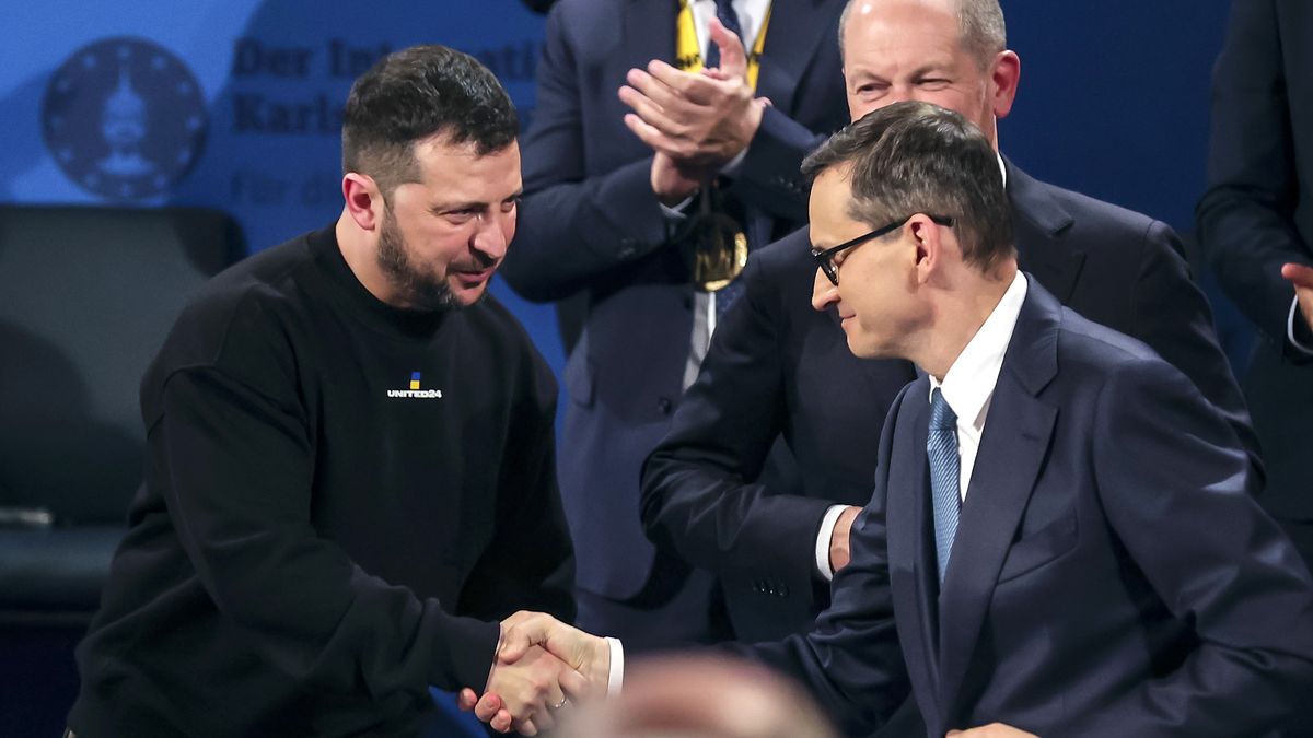 AACHEN, GERMANY - MAY 14: Ukrainian President Volodymyr Zelensky (L) and Polish Prime Minister Mateusz Morawiecki shake hands after the Charlemagne Prize (Karlspreis) ceremony in the town hall on May 14, 2023 in Aachen, Germany. This year's prize will be awarded to Ukraine's President Volodymyr Zelensky and the Ukrainian people. The International Charlemagne Prize of Aachen has been awarded annually since 1950 to people who have contributed to the ideals upon which Europe has been founded.  (Photo by Friedemann Vogel - Pool/Getty Images)