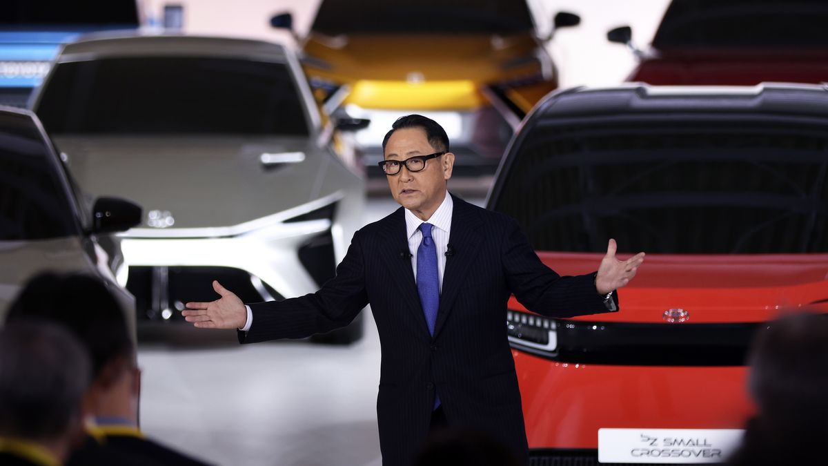 Akio Toyoda, president of Toyota Motor Corp., speaks during a news conference at the company's showroom in Tokyo, Japan, on Tuesday, Dec. 14, 2021. The worlds biggest carmaker is planning to invest 4 trillion yen ($35.2 billion) to supercharge its EV push, with a target to sell 3.5 million units annually by the end of the decade, according to Toyoda. Toyota will roll out 30 electric models by 2030, a step up from a prior plan to introduce 15 EVs globally by 2025. Photographer: Kiyoshi Ota/Bloomberg via Getty Images