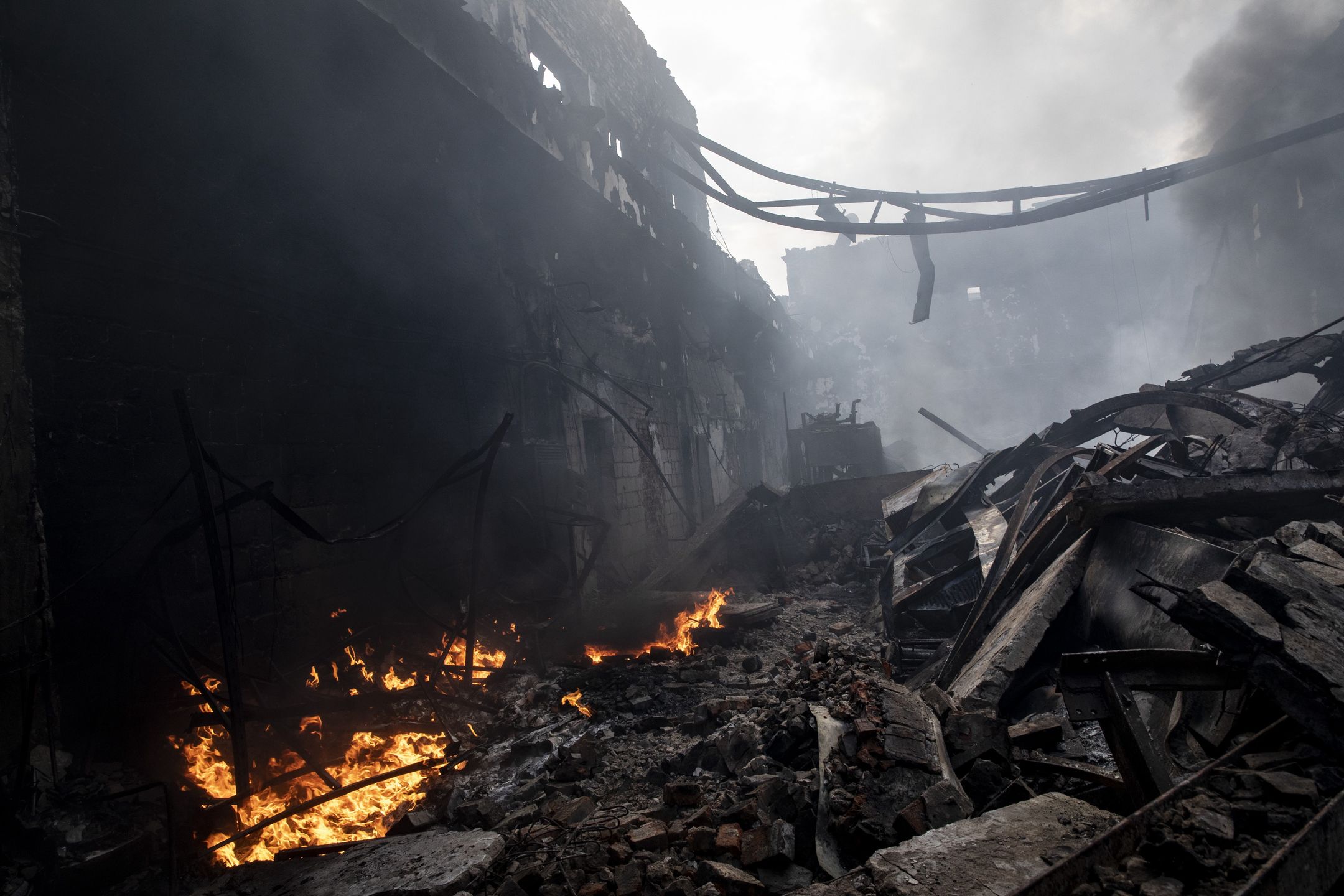 KHARKIV, UKRAINE - 2022/04/30: Burning fuel in the ruins after a Russian shelling hit a petroleum storage depot in Kharkiv. As Russia has re-supply its troops and concentrated the offensive on the eastern part of Ukraine, Kharkiv, the second biggest city in Ukraine now under constant threat of Russian bombardment and airstrikes. (Photo by Alex Chan Tsz Yuk/SOPA Images/LightRocket via Getty Images)