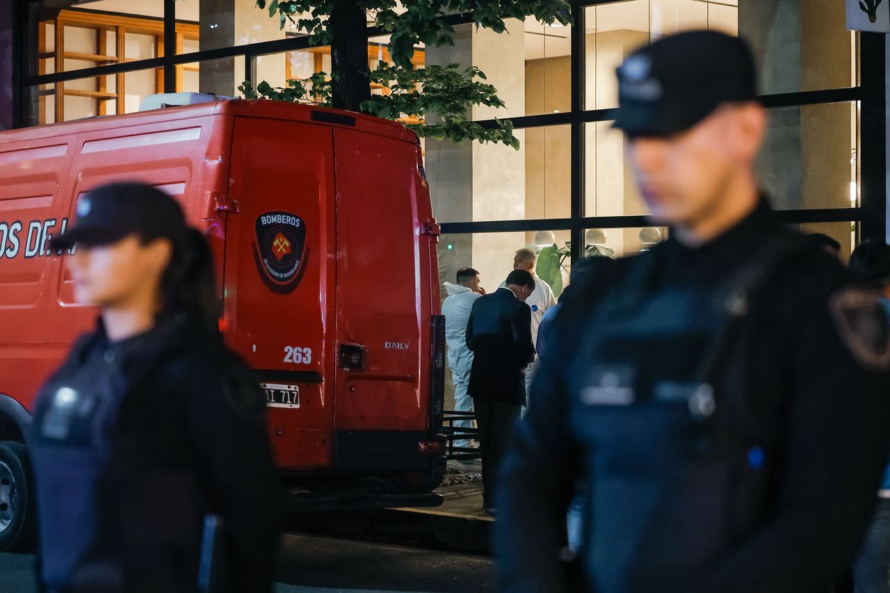 Police at the hotel where Payne died