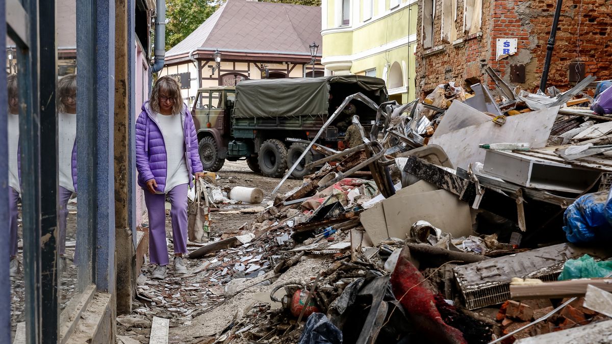 A woman walks pass debris from destroyed  buildings as massive flooding affected tourist resorts in southern Poland - Klodzko, Poland on September 27, 2024. Central Europe, including Poland, experienced widespread flooding after Storm Boris reins. Resorts such as Ladek Zdroj, Klodzko and Stronie Sloskie were particularly affected by a flood wave. The towns are being rebuilt from debris. Europe's intense rainfall in September is twice as likely thanks to climate change, says the World Weather Attribution (WWA) group. (Photo by Dominika Zarzycka/NurPhoto via Getty Images)
