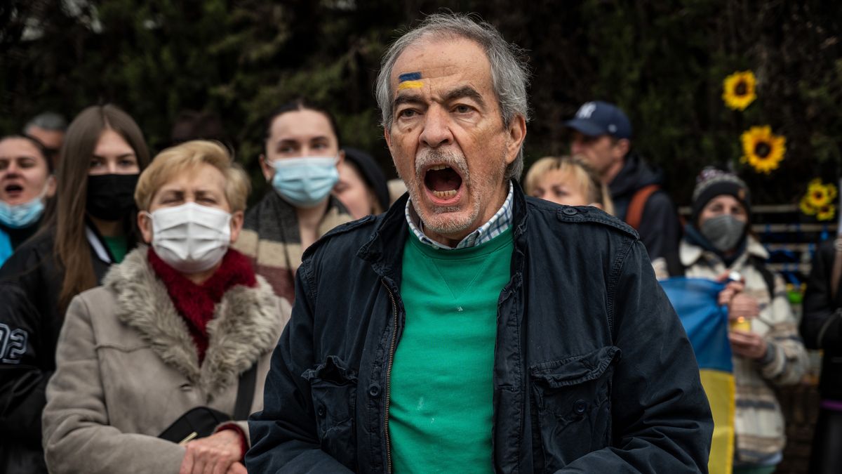 MADRID, SPAIN - 2022/03/31: A man with a Ukrainian flag painted on his head is seen shouting slogans against President Vladimir Putin during a protest in front of the Russian embassy of Madrid. Members of the Ukrainian community have gathered to protest against the Russian invasion of Ukraine with candles, sunflowers and placing a small coffin as a symbol to show the deaths of young kids during the war. (Photo by Marcos del Mazo/LightRocket via Getty Images)