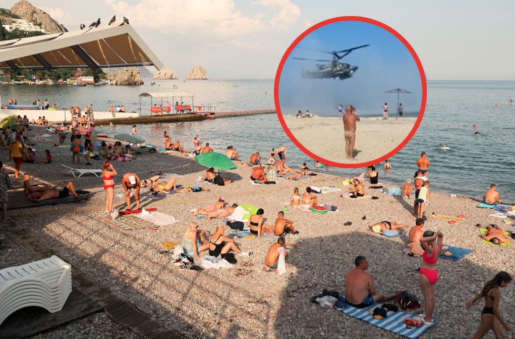 Rosjanie pojechali na wakacje. Część - nie bacząc na wojnę - wybrała Krym. Na zdjęciu plaża nad Morzem Czarnym oraz incydent ze śmigłowcem na plaży w Berdiańsku