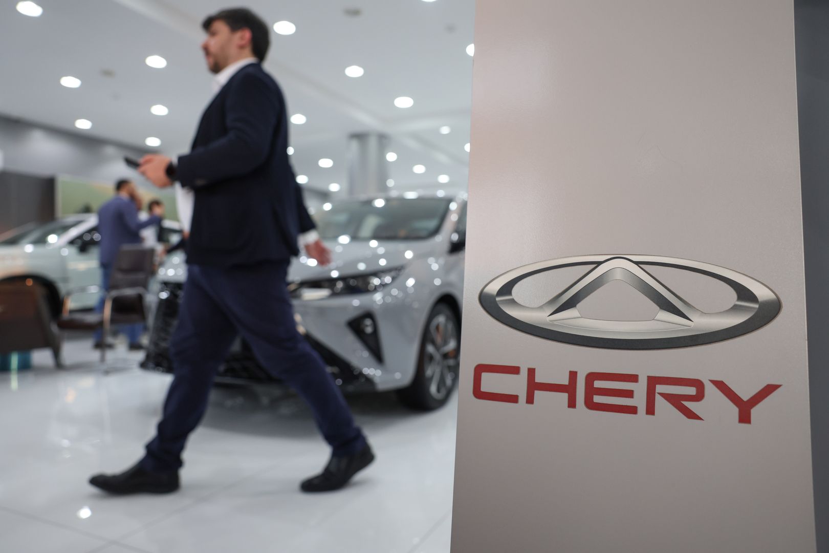 Signage inside a Chery Automobile Co. Ltd. dealership in Doha, Qatar, on Wednesday, Oct. 4, 2023. Chinese electric-vehicle makers are facing one of their biggest challenges yet: convincing drivers in the oil-rich Middle East to switch to battery-powered cars. Photographer: Christopher Pike/Bloomberg via Getty Images