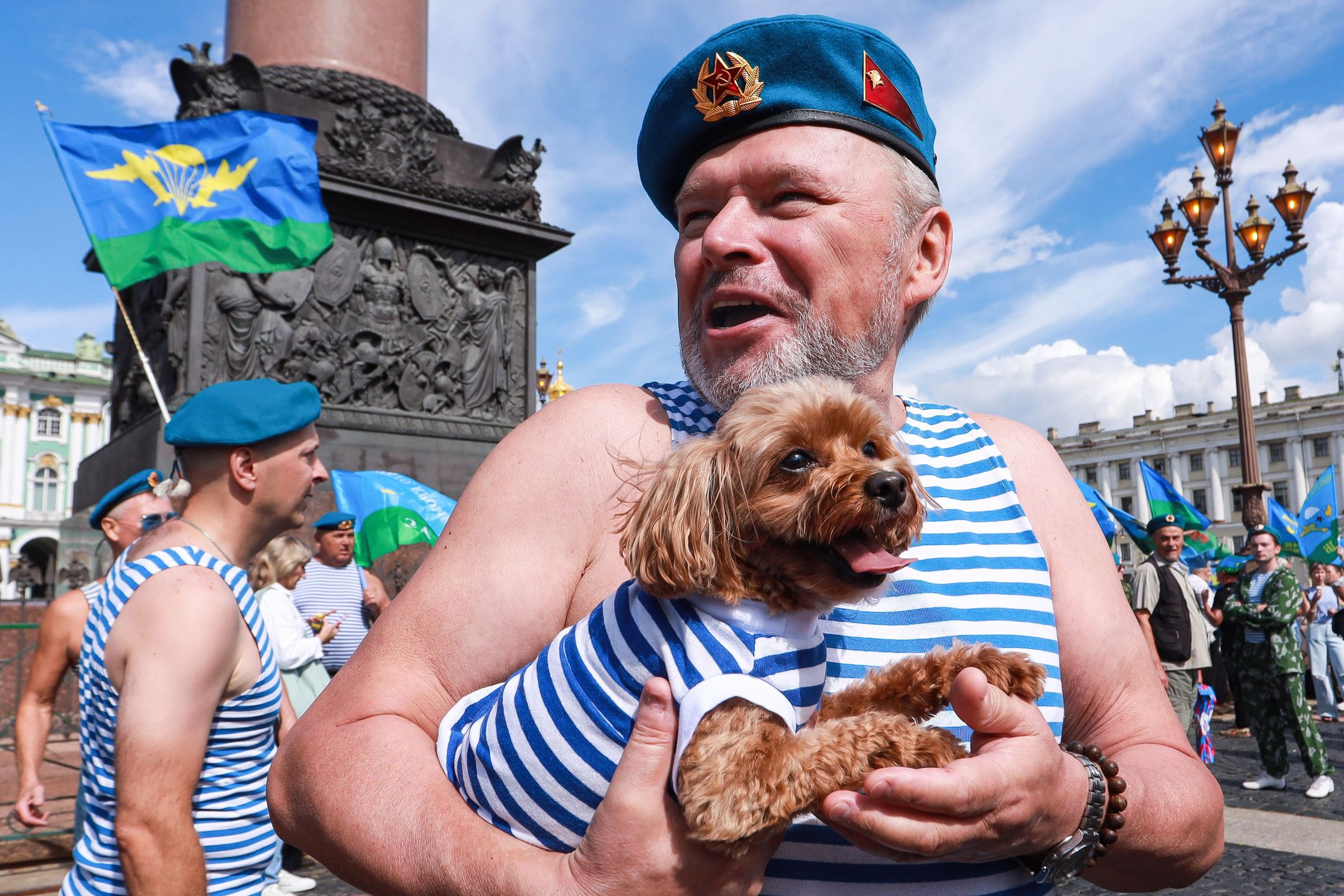 ST  PETERSBURG, RUSSIA - 2024/08/02: An Airborne Forces soldier holds a dog in his arms during the celebration of Airborne Forces Day on Palace Square in St. Petersburg. Airborne Forces Day is an important holiday celebrated on August 2 in the Russian Federation and other post-Soviet countries. This day is dedicated to the Airborne Troops (Airborne Forces), their historical traditions, exploits, and service to the Fatherland. Airborne Forces Day is celebrated through numerous events and activities, including parades, rallies, concerts, and veterans meetings. Military and civilians gather together to express deep respect and gratitude to the paratroopers for their courage and dedication in the performance of their military duties. (Photo by Artem Priakhin/SOPA Images/LightRocket via Getty Images)