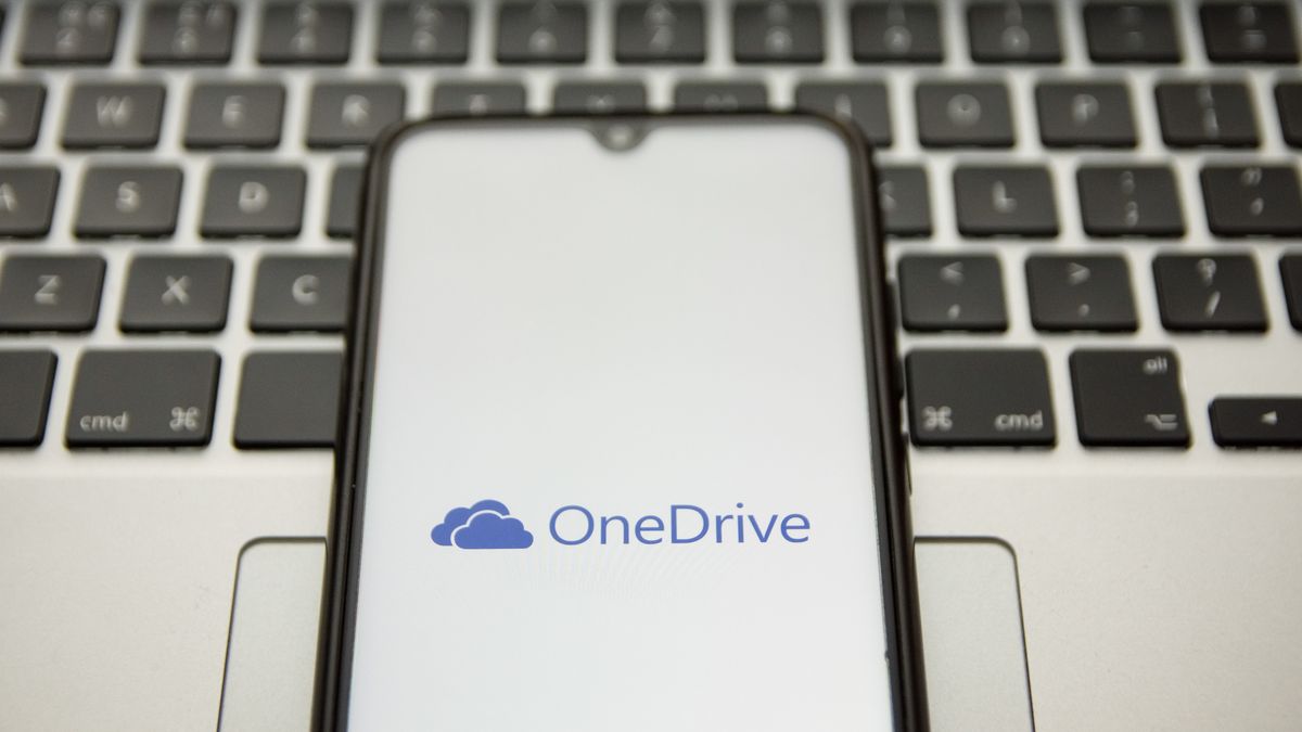 In this photo illustration an OneDrive logo seen displayed on a smartphone screen with a computer keyword in the background in Athens, Greece on January 10, 2022. (Photo by Nikolas Kokovlis/NurPhoto via Getty Images)