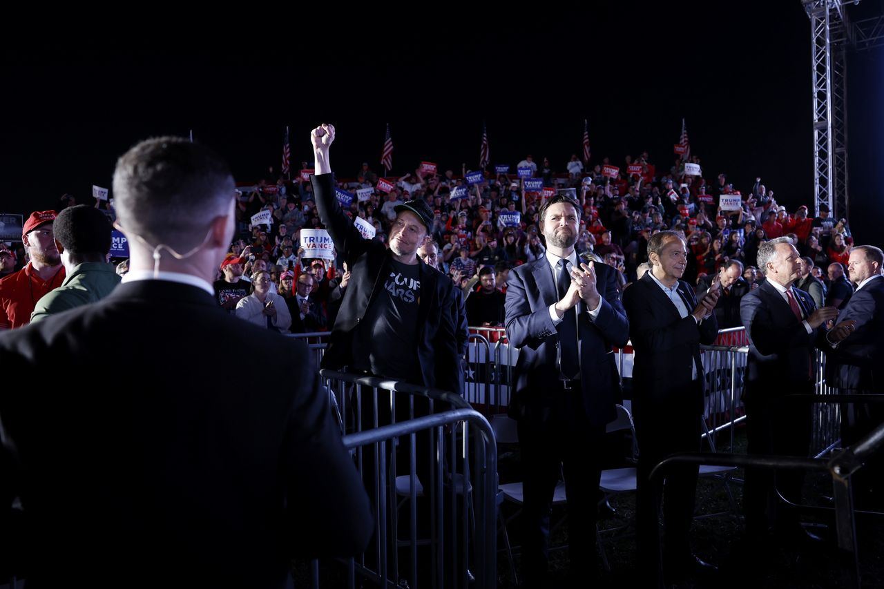 BUTLER, PENNSYLVANIA - OCTOBER 05: Elon Musk and Republican vice presidential candidate Sen. JD Vance listen as Republican presidential nominee, former President Donald Trump speaks at a campaign rally at the Butler Farm Show fairgrounds on October 05, 2024 in Butler, Pennsylvania. This is the first time that Trump has returned to Butler since he was injured during an attempted assassination on July 13. (Photo by Anna Moneymaker/Getty Images)