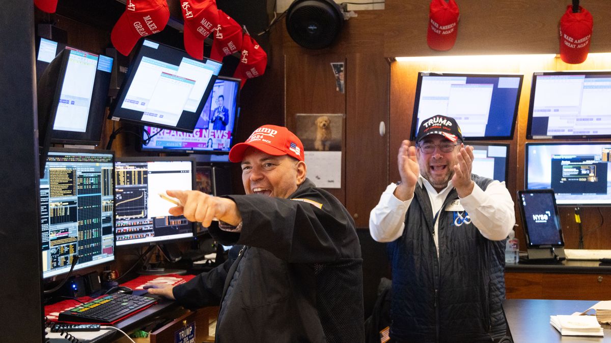 Traders wearing Trump hats celebrate the re-election of US President-elect Donald Trump on the floor of the New York Stock Exchange (NYSE) in New York, US, on Wednesday, Nov. 6, 2024. Donald Trump quickly put his stamp on financial markets as his victory in the US presidential election propelled "Trump Trade" plays across assets. Photographer: Michael Nagle/Bloomberg via Getty Images