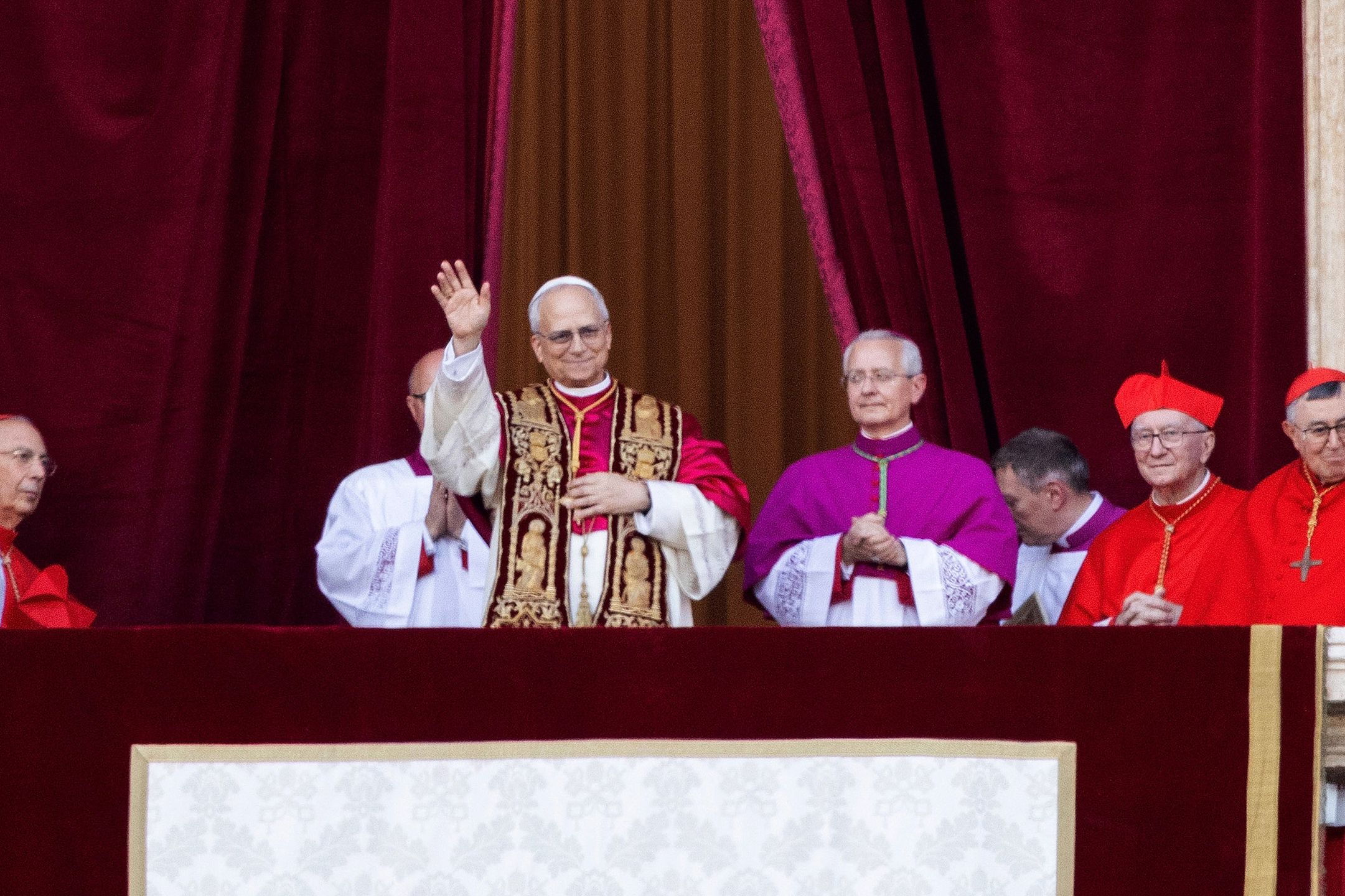 VATICAN CITY, VATICAN - MAY 08: Cardinals gather as the newly elected Pontiff, Pope Leo XIV is seen for the first time from the Vatican balcony on May 08, 2025 in Vatican City, Vatican. White smoke was seen over the Vatican early this evening as the Conclave of Cardinals took just two days to elect Cardinal Robert Francis Prevost, who will be known as Pope Leo (Leone) XIV, as the 267th Supreme Pontiff after the death of Pope Francis on Easter Monday. (Photo by Ernesto Ruscio/Getty Images)