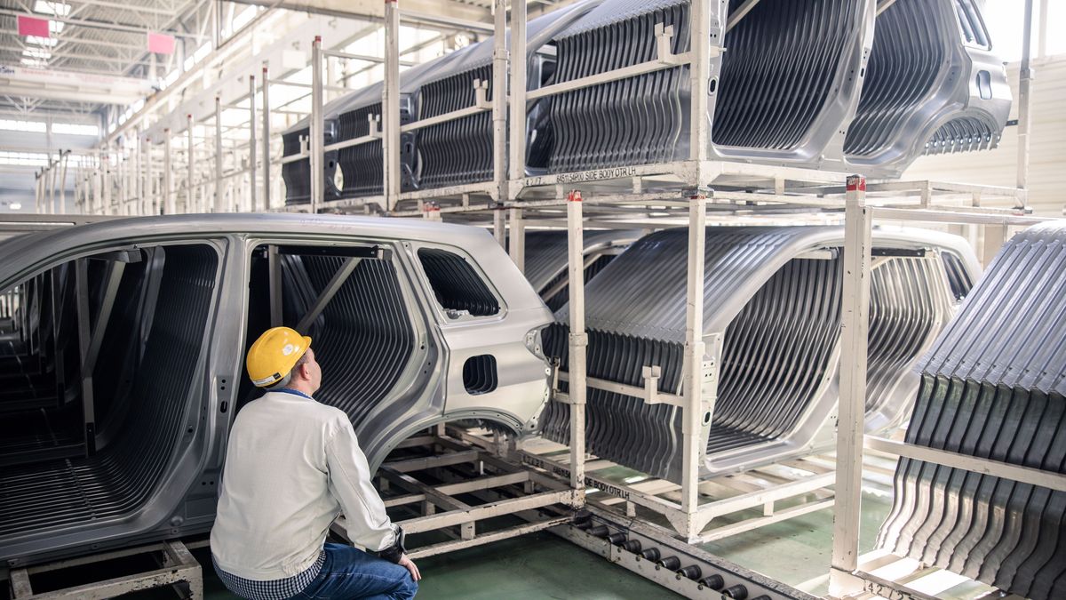 An employee inspects automobile body panels stacked inside the Suzuki Motor Corp. plant in Esztergom, Hungary, on Wednesday, Oct. 19, 2022. European automotive stocks gained a boost from figures showing that new car sales in the region rose for a second month in September as supply-chain issues eased. Photographer: Akos Stiller/Bloomberg via Getty Images