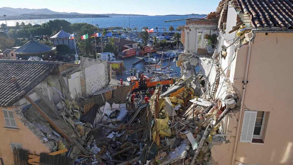 TemporaryFrench firefighters search the rubble for missing inhabitants after a building collapsed in Sanary-sur-Mer, on December 7, 2021. - Five people are "probably trapped in the rubble" of a three-story apartment building that collapsed overnight in Sanary-sur-Mer, Var, following an explosion that may have been caused by a gas problem, according to the firefighters. (Photo by NICOLAS TUCAT / AFP)NICOLAS TUCAT