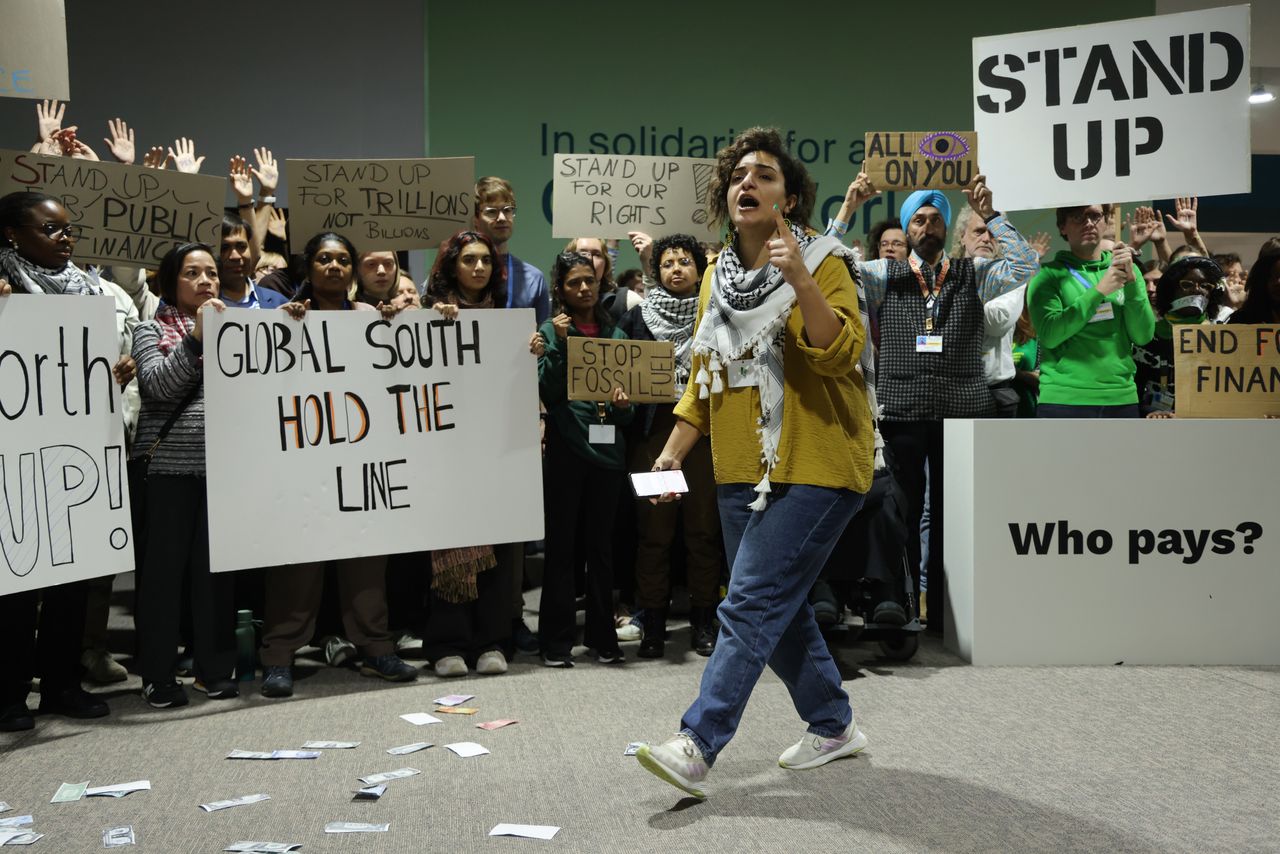 BAKU, AZERBAIJAN - NOVEMBER 23: Haneen Mahmoud Ali Hamed of Climate Action Network International leads activists protesting for climate finance grants for poor countries on day twelve at the UNFCCC COP29 Climate Conference on November 23, 2024 in Baku, Azerbaijan. The COP29, which was scheduled to end yesterday, has gone into overtime, with parties meeting and deliberating over the text of the final agreement following heavy criticism by a wide array of delegates of earlier drafts. 
